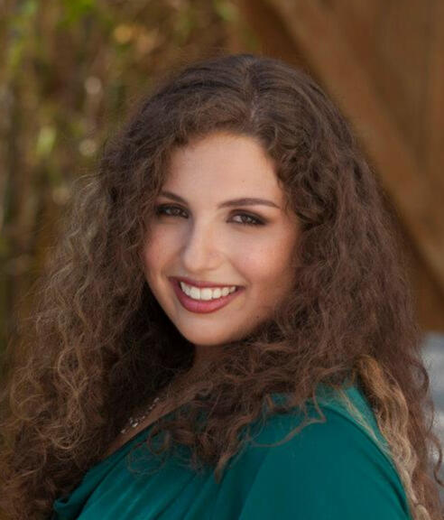 Author Brittany Lawrence Author Brittany Lawrence in a green shirt, smiling for the camera looking over her left shoulder.